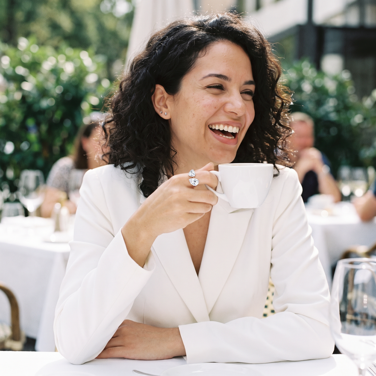 Aureole Moissanite Heart & Tear Ring worn at a sunlit terrace brunch