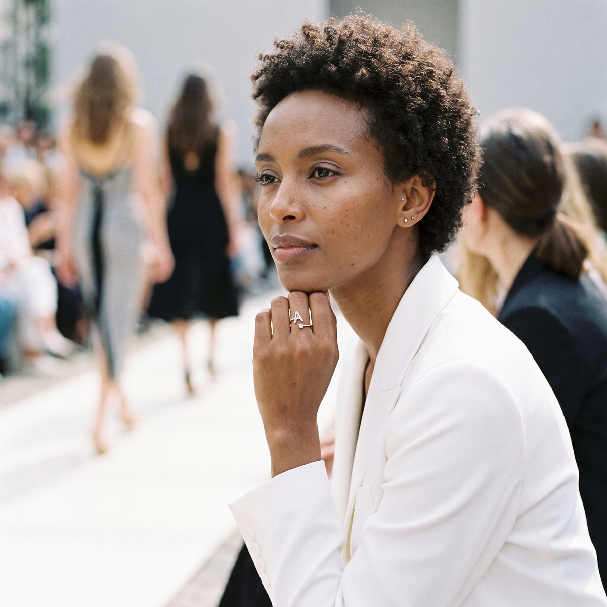 Aureole Alphabet Letter Ring worn front row at a fashion show